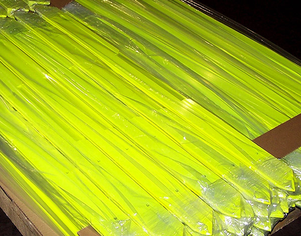 Plastic packaging on neon yellow parts.