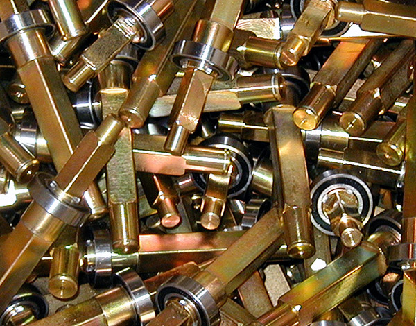 Numerous brass looking custom aluminum fabricated parts.