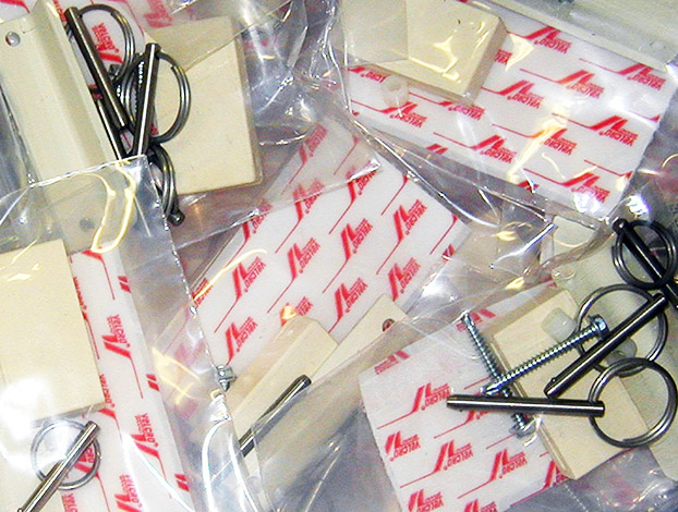 Numerous metal components each separated in plastic bags for shipping.