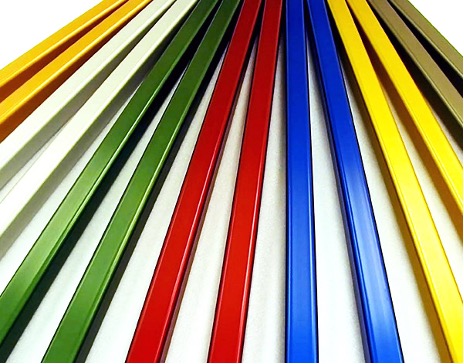 Aluminum rods in a variety of colors. The rods are neatly arranged in rows, and their different colors create a visually appealing display. The rods are of different lengths and thicknesses, suggesting they are used for various purposes.