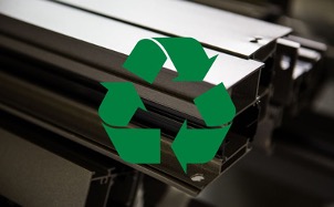 Aluminum extrusions with a green recycling symbol, indicating the recyclability of aluminum materials.